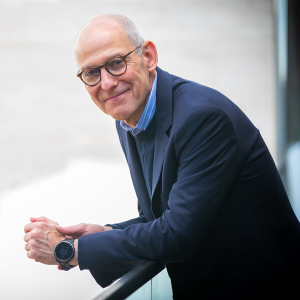 zeke emanuel leaning on railing in perry world house