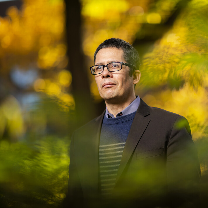 roberto gonzales with autumn leaves behind him